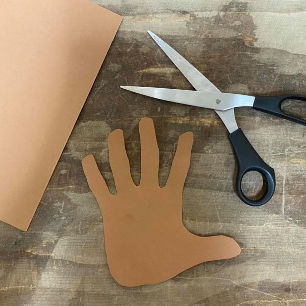 Tracing hand on brown construction paper