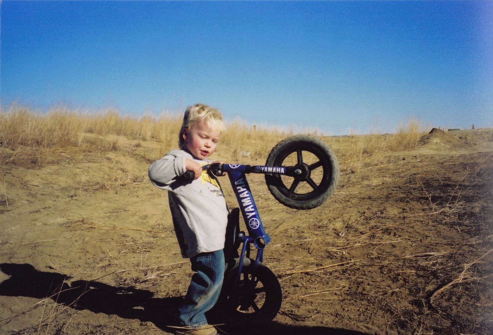 Boy does a wheelie on the first blue Strider Yamaha Balance Bike
