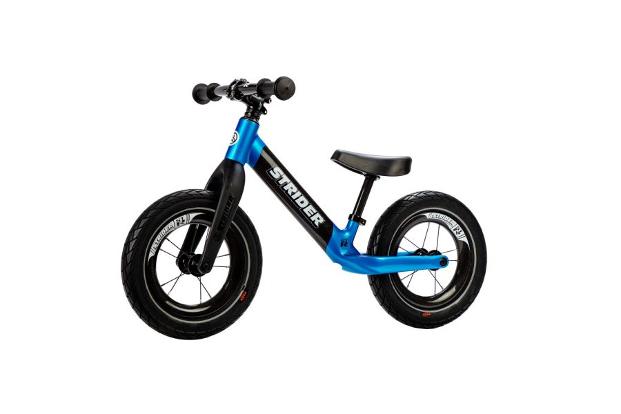 Studio image of blue Strider ST-R carbon fiber balance bike