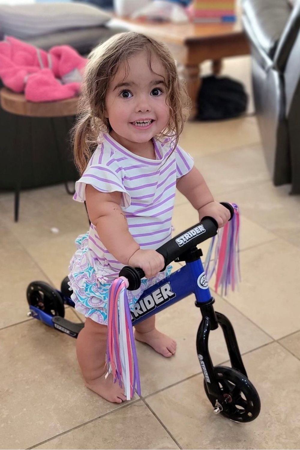 Jordyn tests out her Adaptive Strider Bike