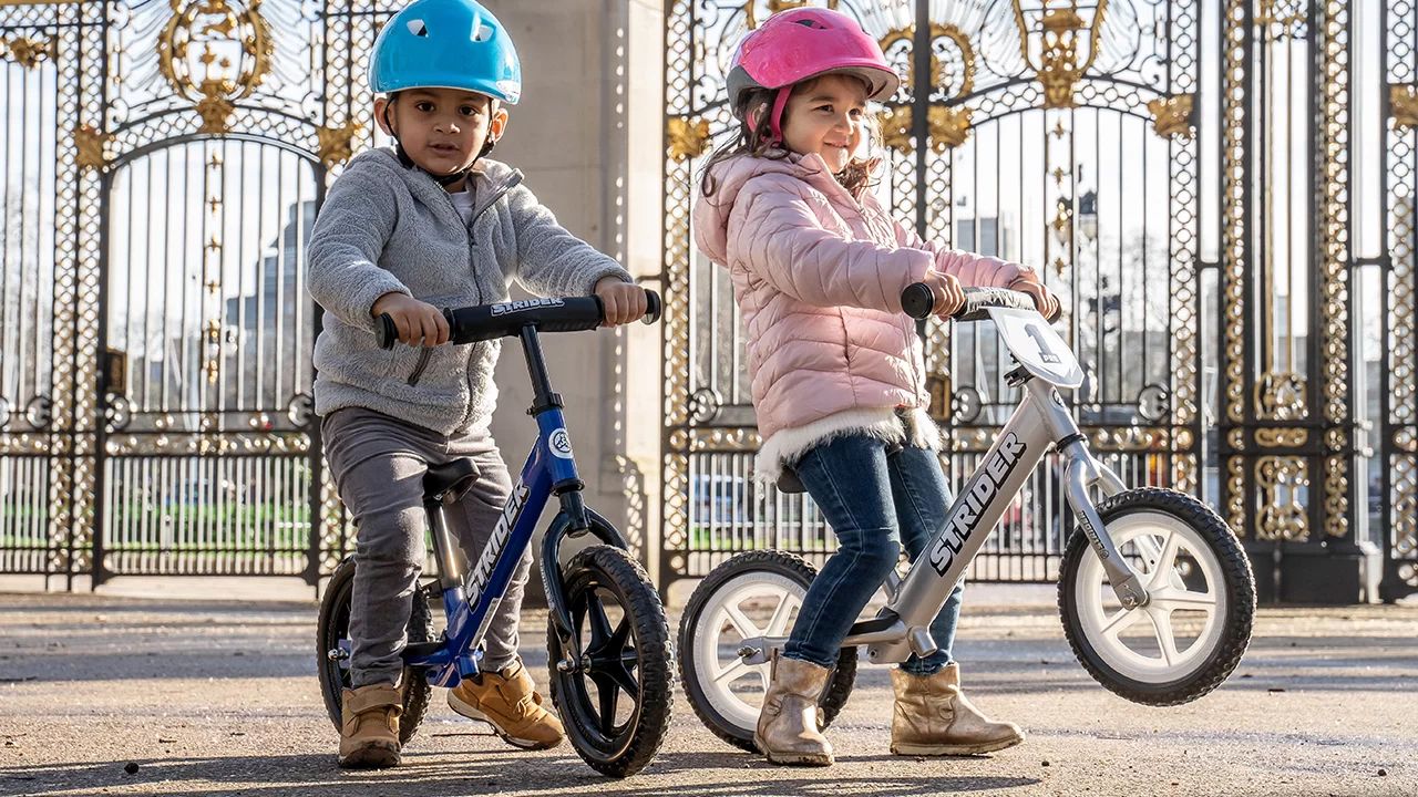 Boy and Girl on 12-inch Balance Bikes