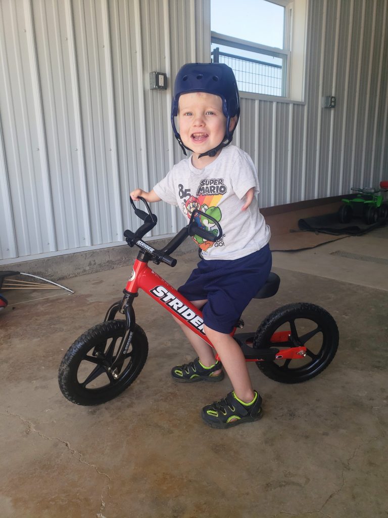 Tabor rides his Adaptive Strider Bike